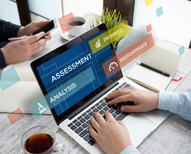 assessment-image-laptop | PHF laptop with the words analysis, assessment, performance, and progress